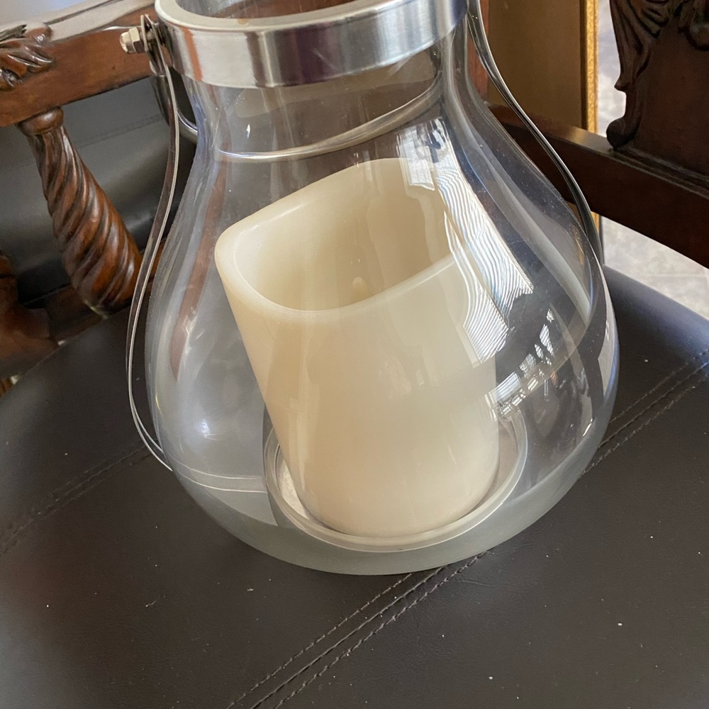 Like new takes battery and works lights up candle